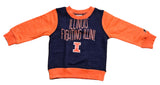Navy and orange long-sleeve shirt with 'Illinois Fighting Illini' text on a cardboard surface.
