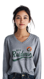Woman wearing a gray long-sleeve shirt with 'WSU Raiders' logo on a white background